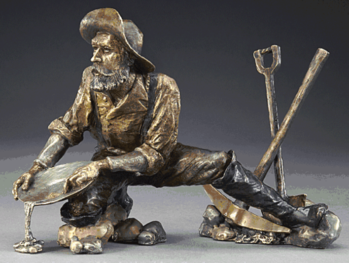 Bronze sculpture by Mark Hopkins in a gallery, showcasing intricate details and emotional depth